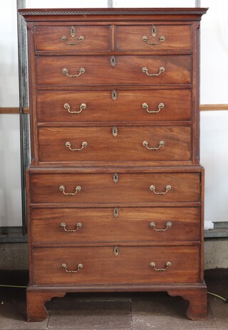 A Georgian mahogany chest on chest, the upper section with moulded cornice with Grecian key decoration and canted fluted column to the sides, fitted 2 short and 3 long drawers, the base fitted 3 drawers, raised on bracket feet 187cm h x 109cm w x 57cm d 