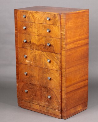A 1930's Art Deco figured walnut chest of 6 drawers, raised on a platform base 121cm high x 75cm w x 48cm d 