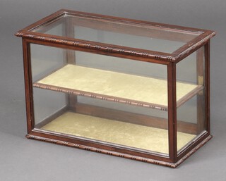 A Victorian rectangular rosewood table top display cabinet fitted shelves enclosed by a glazed panelled door 33cm h x 51cm w x 25cm d 