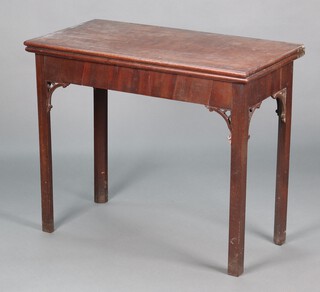 A George III rectangular mahogany cantilever card table, raised on chamfered supports with pierced brackets to the tops of the legs 74cm h x 90cm w x 44cm d  
