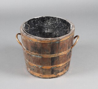 An oak and copper coopered twin handled log bin with metal liner, 35cm h x 42cm diam. 