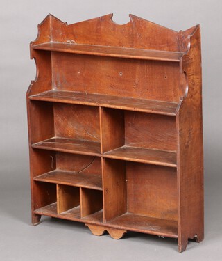 An 18th Century elm bookcase fitted 4 shelves and 3 pigeon holes 88cm w x 73cm d x 18cm d 