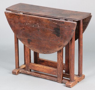 An 18th Century oak gateleg drop flap tea table, raised on octagonal supports 67cm h x 84cm w x 25cm 