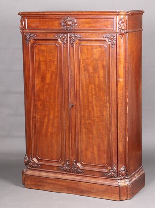A 19th Century carved walnut "knock down" cabinet, the upper section fitted a drawer, the interior fitted a hanging rail (formerly racked for shelves) enclosed by a pair of panelled doors 189cm h x 103cm w x 46cm d  
