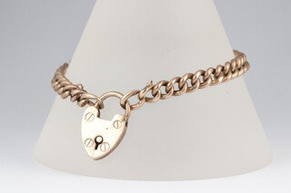 A 9ct gold curb link bracelet with padlock clasp, 18cm, 8.4g