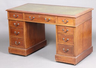 An Edwardian inlaid mahogany kneehole desk with green leather writing surface above 1 long and 8 short drawers, raised on a platform base 76cm h x 123cm w x 64cm d 