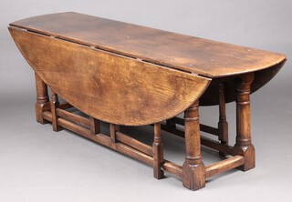 A reproduction 18th Century oak drop flap gateleg Wake or Hunt table 72cm h x 226cm w x 54cm d 