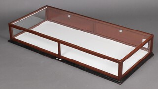A rectangular plate glass and mahogany table top display cabinet 21cm h x 134cm w x 59cm d 