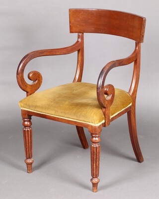 A 19th Century mahogany bar back open arm chair with upholstered seat raised on turned and reeded supports 