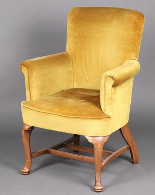 A 1950's Queen Anne style tub back chair upholstered in mustard coloured material, raised on cabriole supports with double H framed stretcher 