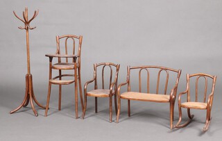 A child's 1920's Thonet style bentwood and woven cane high chair 62cm h x 23cm w x 27cm d (repair to stretcher) together with a child's bentwood 2 seat sofa with oven cane seat 40cm x 42cm w x 20cm  (old repair to back),ditto open arm chair 40cm h x 24cm w x 19cm (old repair to casting rail), a rocking chair 37cm h x 42cm w x 23cm d and a hat and coat stand 85cm x 27cm (1 arm missing) 