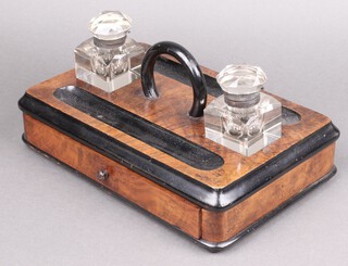 A Victorian walnut and ebonised 2 bottle standish fitted 2 cut glass ink wells and double pen recess, the base fitted a drawer 14cm h x 32cm w x 21cm d 