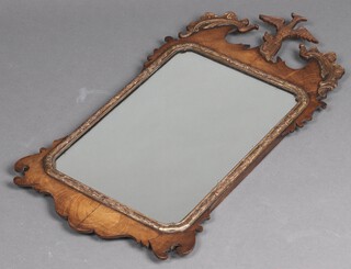 A Chippendale style rectangular plate arch shaped mirror in a walnut frame surmounted by an eagle 77cm x 40cm  