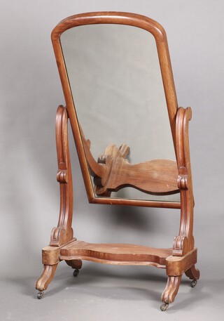 A Victorian arched plate cheval mirror in a mahogany frame 156cm h x 77cm w x 56cm d
