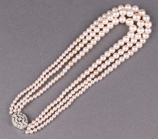 A triple strand of Ciro cultured pearls with paste set clasp, with original certificate and box