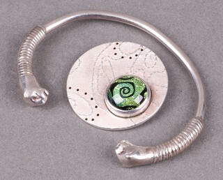 A silver bangle with leopard head ends and a stylish silver pendant, 30g gross