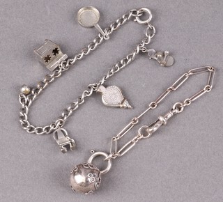 A child's white metal fetter link bracelet and a white metal curb link charm bracelet hung 5 charms  