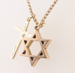 A 9ct gold marked 375 chain 65cm hung 2 pendants in the form of a cross and a star, gross weight 7.1g