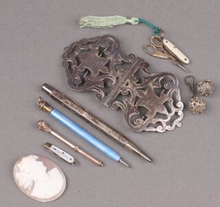A Victorian pierced silver nurses buckle Birmingham 1896, 41g, a shell carved cameo portrait of a lady, 2 propelling pencils etc 