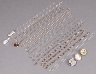 A silver ingot pendant hung on a silver chain, a silver locket on a box link silver chain, 27g, together with 2 micro mosaic brooches, a metal chain, a shell carved cameo pendant a gilt metal chain set a swivel hardstone pendant, and 3 other gilt chains 