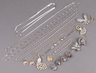 A marcasite brooch in the form of an eagle, a ditto rose shaped brooch, a Tiffany and Co. gold plated key pin marked Canberra a pair of circular metal paste set earrings and other items  of costume jewellery 