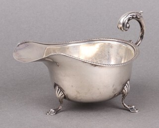 A silver sauce boat with C scroll handle, Birmingham 1933 by S Blanckensee & Sons, 80g 