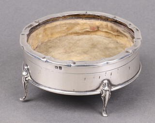 A circular silver trinket box with hinged lid on panelled supports, Birmingham 1916, 5cm x 10cm (lid missing) 