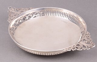 An Edwardian circular pierced twin handle silver bowl, London 1906 by Josiah Williams & Co., marks rubbed, 265g 