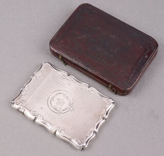 A Victorian engraved silver card case with armorial decoration, Birmingham 1854 by Nathanial Mills, 59g 