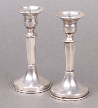 A pair of Continental 800 miniature candlesticks on circular bases, 56g 