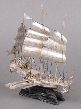 A Chinese white metal model of a 3 masted Junk with oars 17cm x 14cm x 4cm 