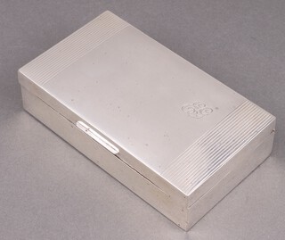 An Art Deco silver cigarette box with engine turned decoration, monogrammed, marks rubbed, 4cm x 15cm x 9cm 