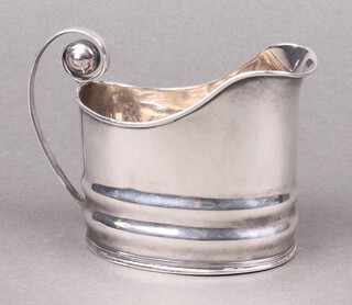 A Georgian style white metal cream jug 8cm