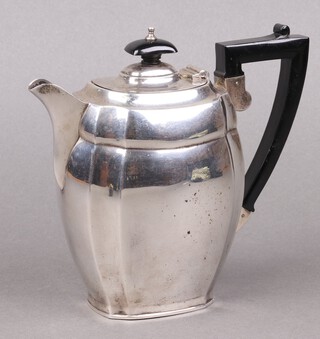 A silver hot water jug with ebonised handle, Birmingham 1914, 494 gross