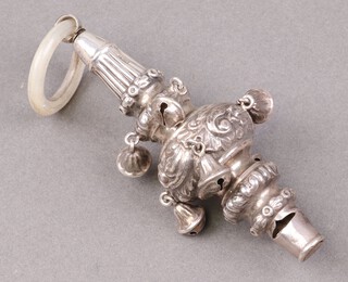 A child's embossed silver rattle with teething ring, Chester 1912 by E S Barnsley & Co., gross weight 69g 