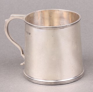 A plain silver christening tankard, Birmingham 1920, marks rubbed, 119g 