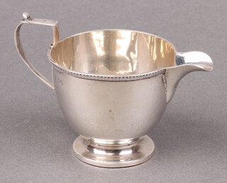 A silver cream jug Birmingham 1923, marks rubbed, 61g 