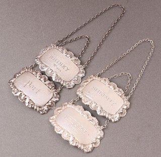 Four embossed silver decanter labels - Port, Sherry, Whisky and Sherry, dated London 1962, 1963, 1964 and 1967