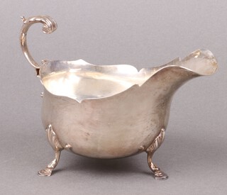 A silver sauce boat with wavy  border and C scroll handle, Birmingham 1919, by S Blanckensee and Sons, 189g 
