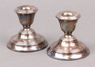 A pair of circular silver squat candlesticks Birmingham 1923, marks rubbed 8cm 
