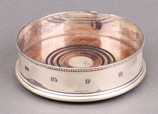 A silver and mahogany bottle coaster, London 1994 