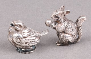 A white metal figure of a squirrel 1.5cm and 1 other of a bird 1.5cm 