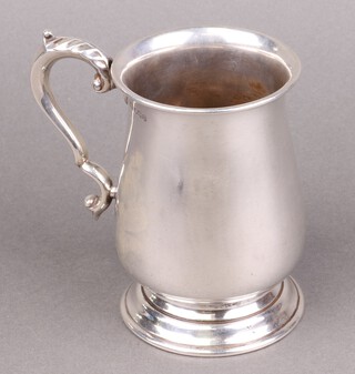 A silver tankard of baluster form Sheffield 1946, by Harrison Brothers and Howson, 326g  