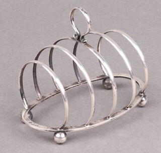 A silver 5 bar toast rack on bun feet Birmingham 1924 by George Unite, 60g 