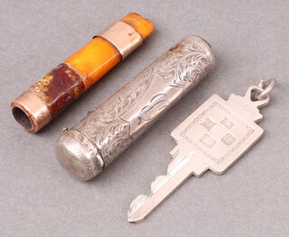 An Edwardian engraved silver mounted cheroot holder case, monogrammed, Birmingham 1900, an amber cheroot holder with 9ct gold mount and a silver pendant door key, monogrammed, Birmingham 1953, 29g 
