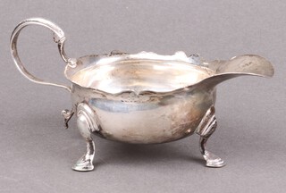 A Georgian silver sauce boat with wavy border London 1784, marks rubbed, 108g 