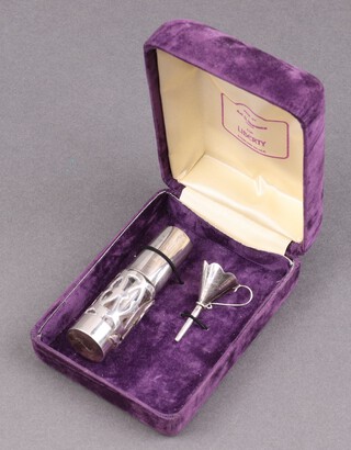 A silver perfume bottle with sprayer and funnel, London 1991 by Ari D Norman, contained in a plush Liberty case 