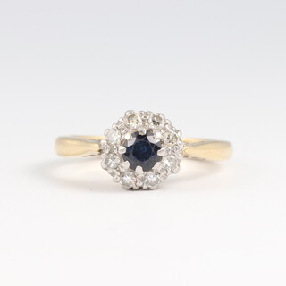 A gold and platinum ring marked 18ct PLAT sapphire and diamond cluster ring, size F 1/2, 3.4g 