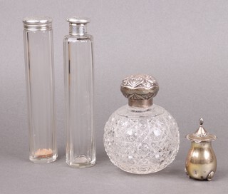 A cut glass globular shaped scent bottle with embossed silver lid (no stopper) Birmingham 1904, a faceted glass scent bottle with silver lid marks rubbed, a faceted glass pin jar with silver lid London 1895 (glass chipped) and a silver pepper (feet f), weighable silver 60g 