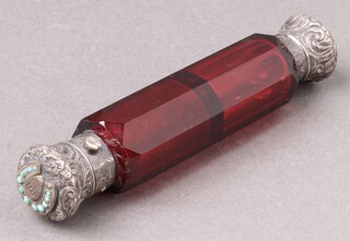 A red faceted glass double ended scent bottle with embossed metal lid (1 end jammed)